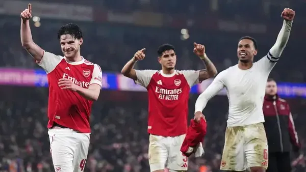 Arsenal’s Declan Rice (left), Piero Hincapie and Gabriel celebrate after beating Chelsea to reach the Carabao Cup final (John Walton/PA)